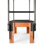 Cadillac Kauffer de alta resistencia para estudios de Pilates, con trapecio estofado y molas premium.